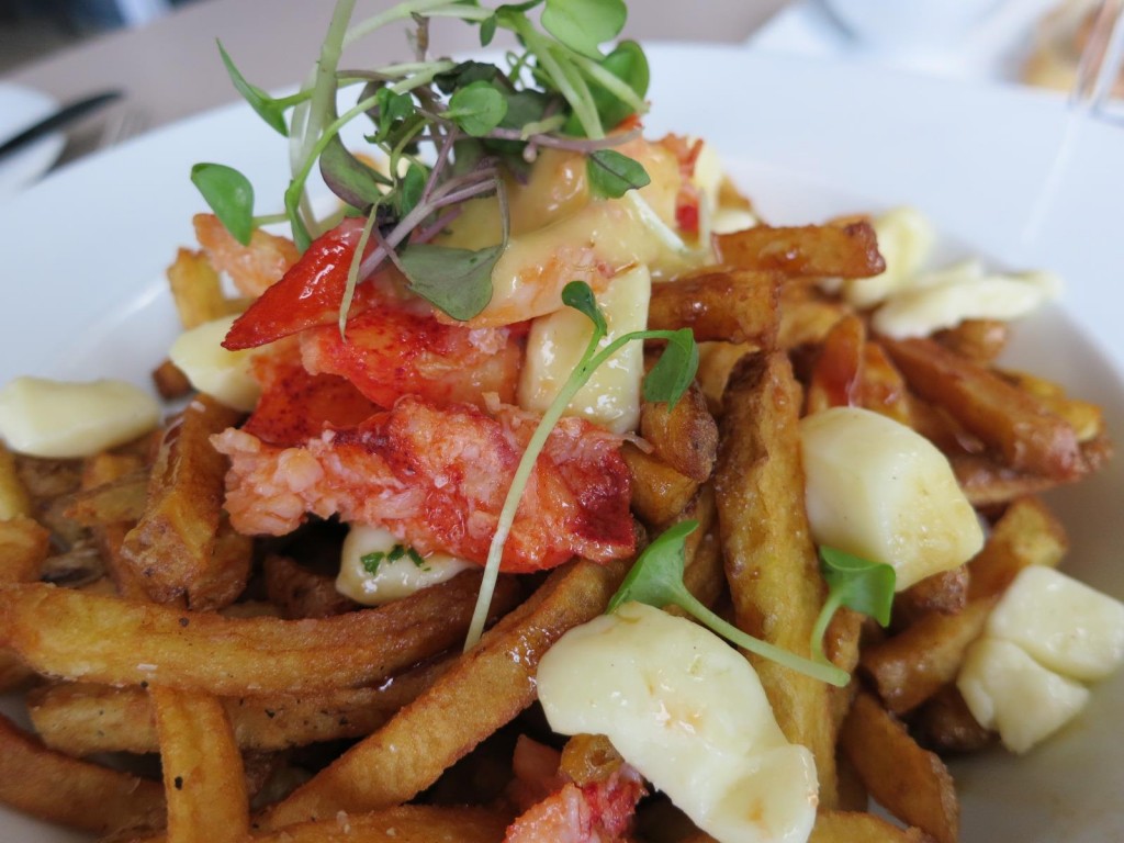 Nova Scotia Lobster PoutineHouse Cut Yukon Fries, Butter Poached Lobster, White Cheddar Cheese Curds, Red Wine Veal Jus, Hollandaise Sauce