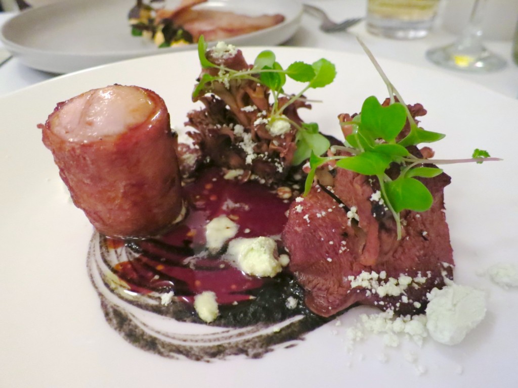 Rabbit rabbit saddle and leg with braised leeks, hen of the woods mushrooms, and rabbit vinaigrette