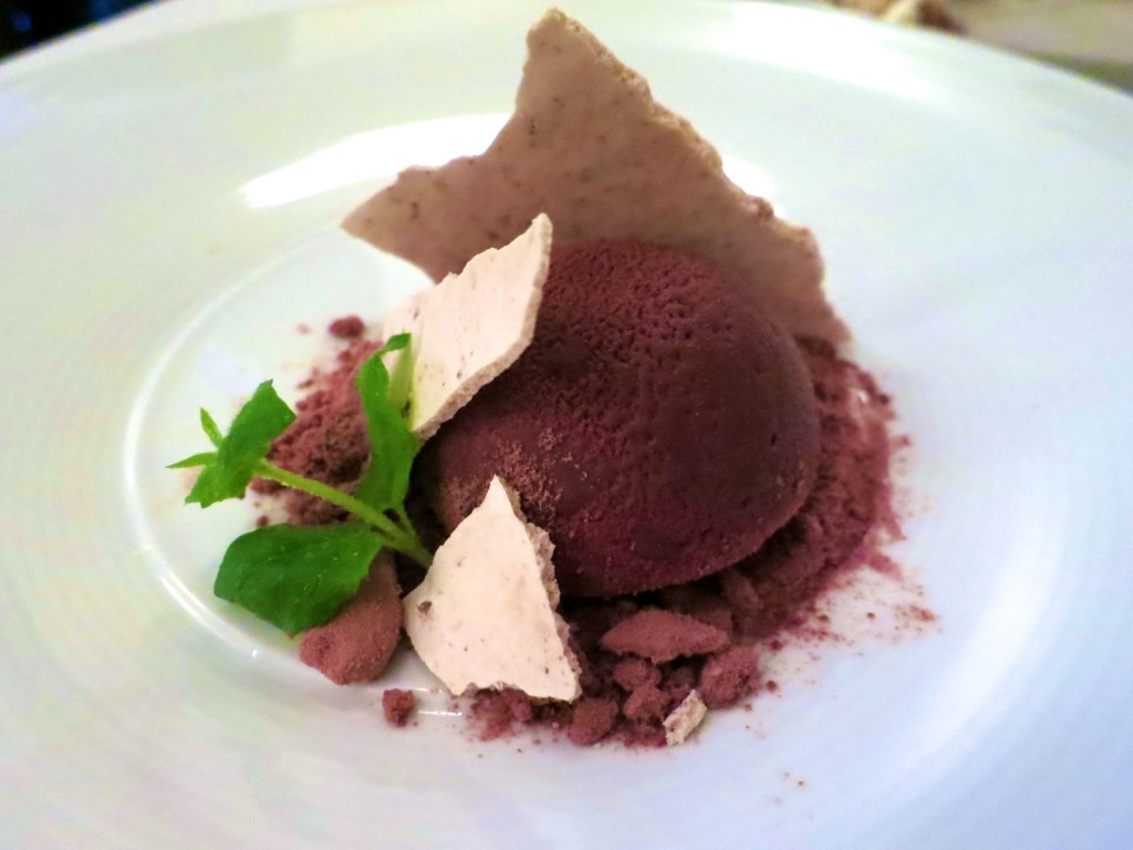Chocolate chocolate bombe , spearmint, cocoa snow and caramelized white chocolate crunch